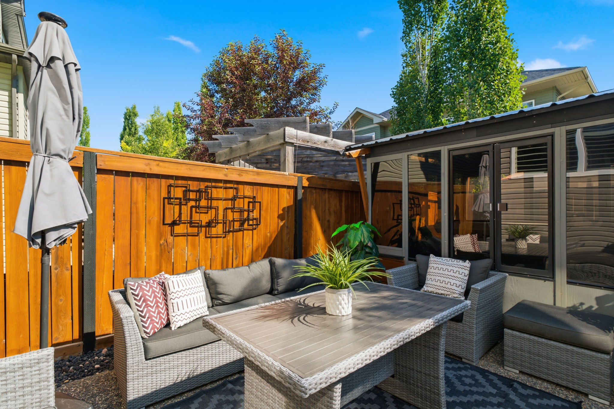 Landscaped backyard seating area and enclosed gazebo