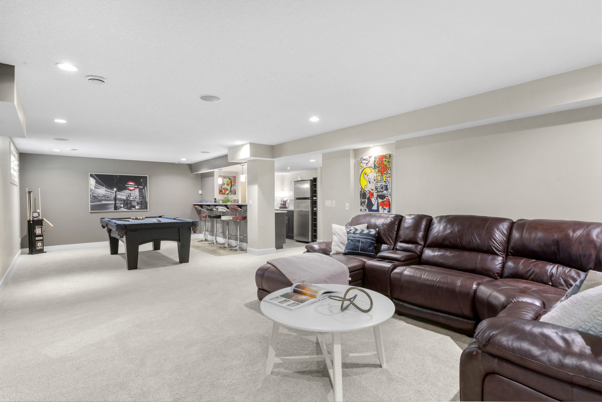 Finished lower-level recreation room with pool table