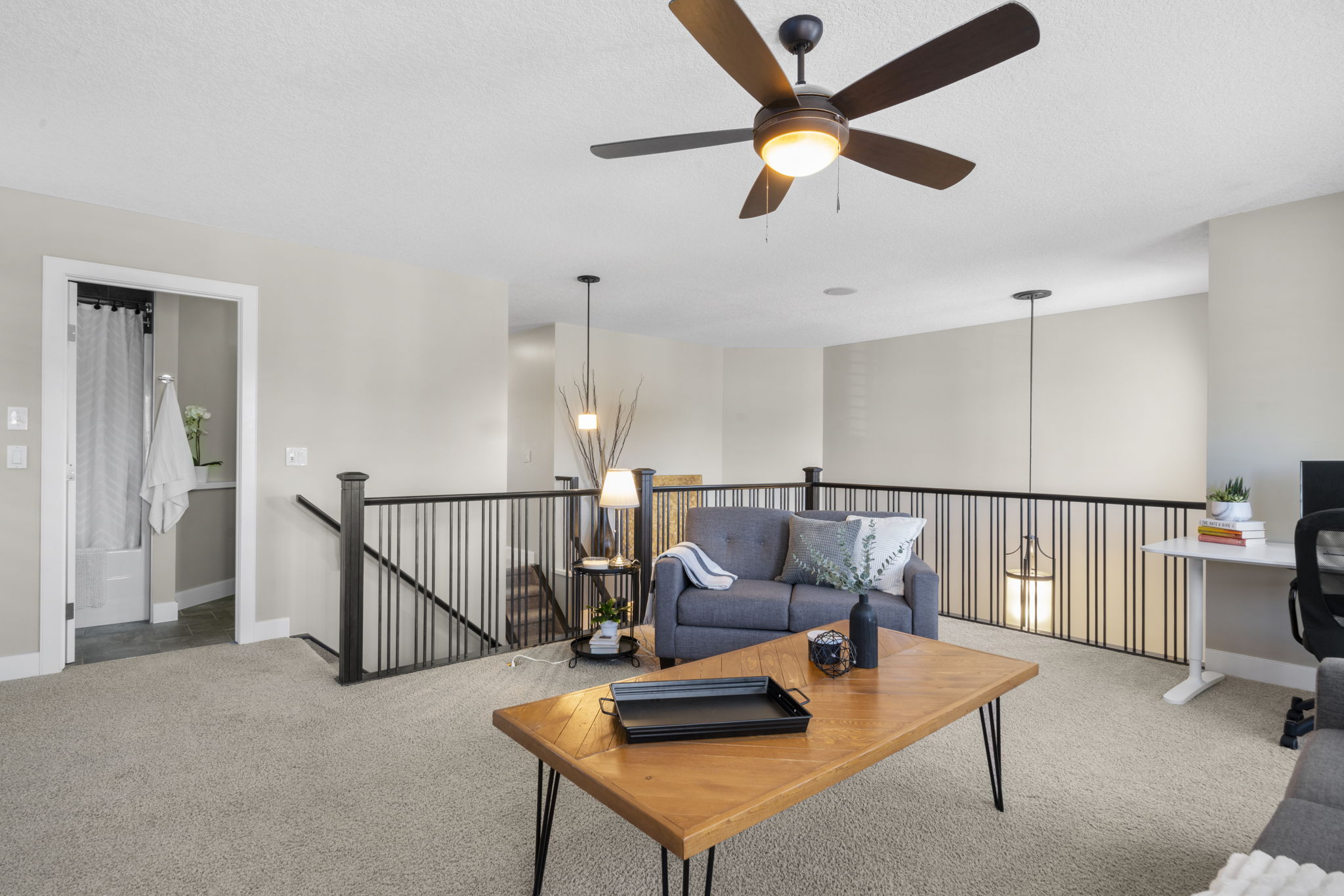 Large bonus room with fireplace and television