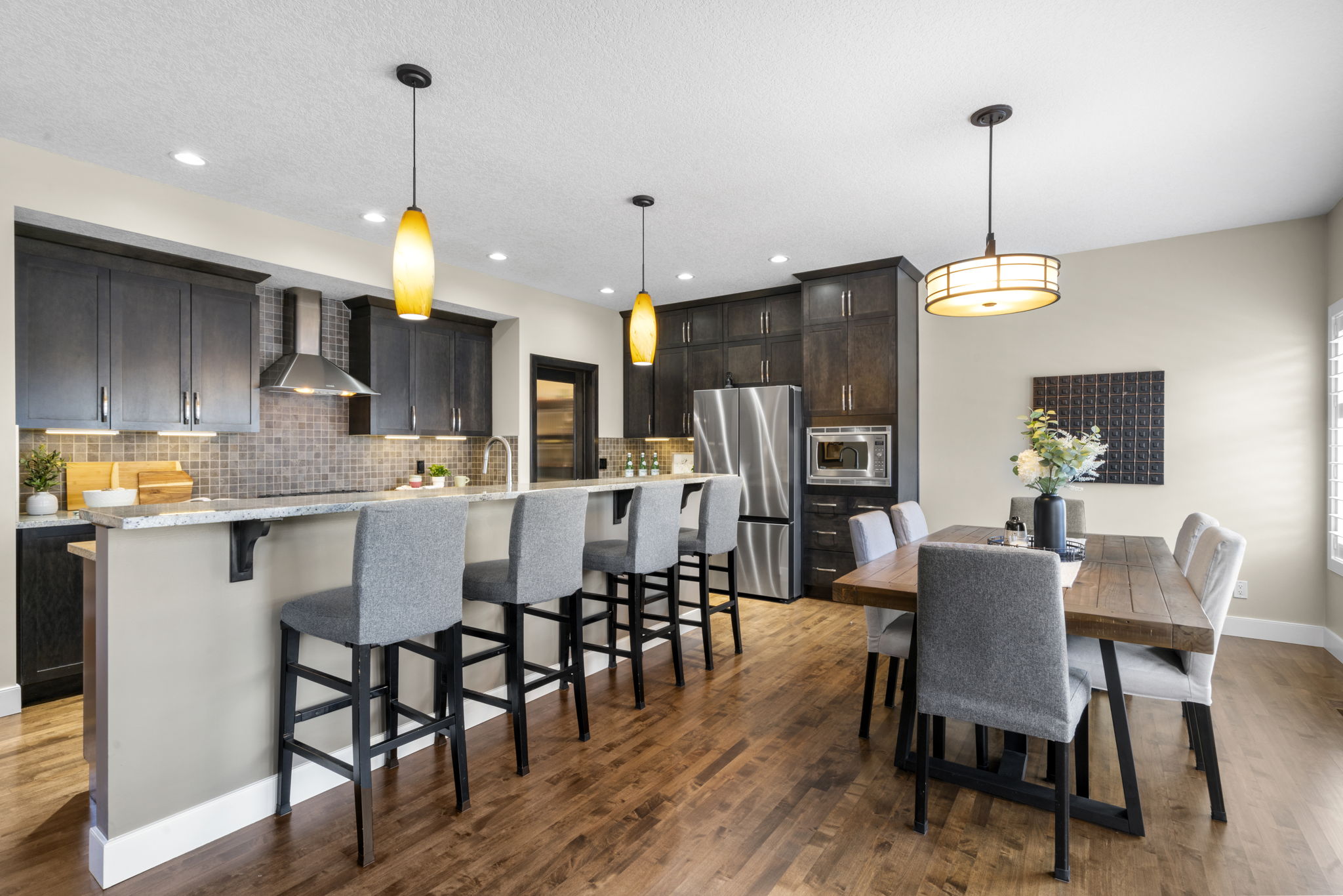 Kitchen island with seating and adjacent dining space